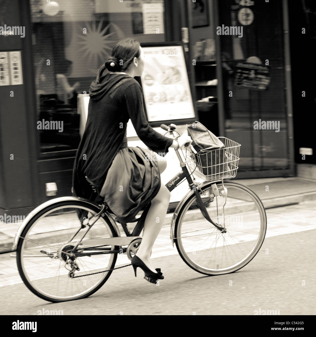Woman riding a bicycle, Tokyo, Japan Stock Photo Alamy