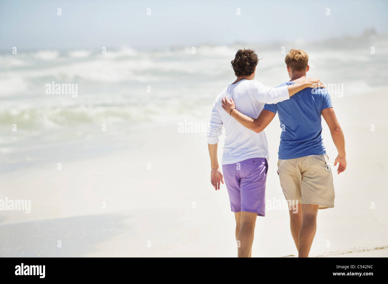 Rear View Of Two Men Walking With Their Arms Around Each Other Stock Photo Alamy Rear View Of Two Men Walking With Their Arms Around Each Other Stock Photo Alamy