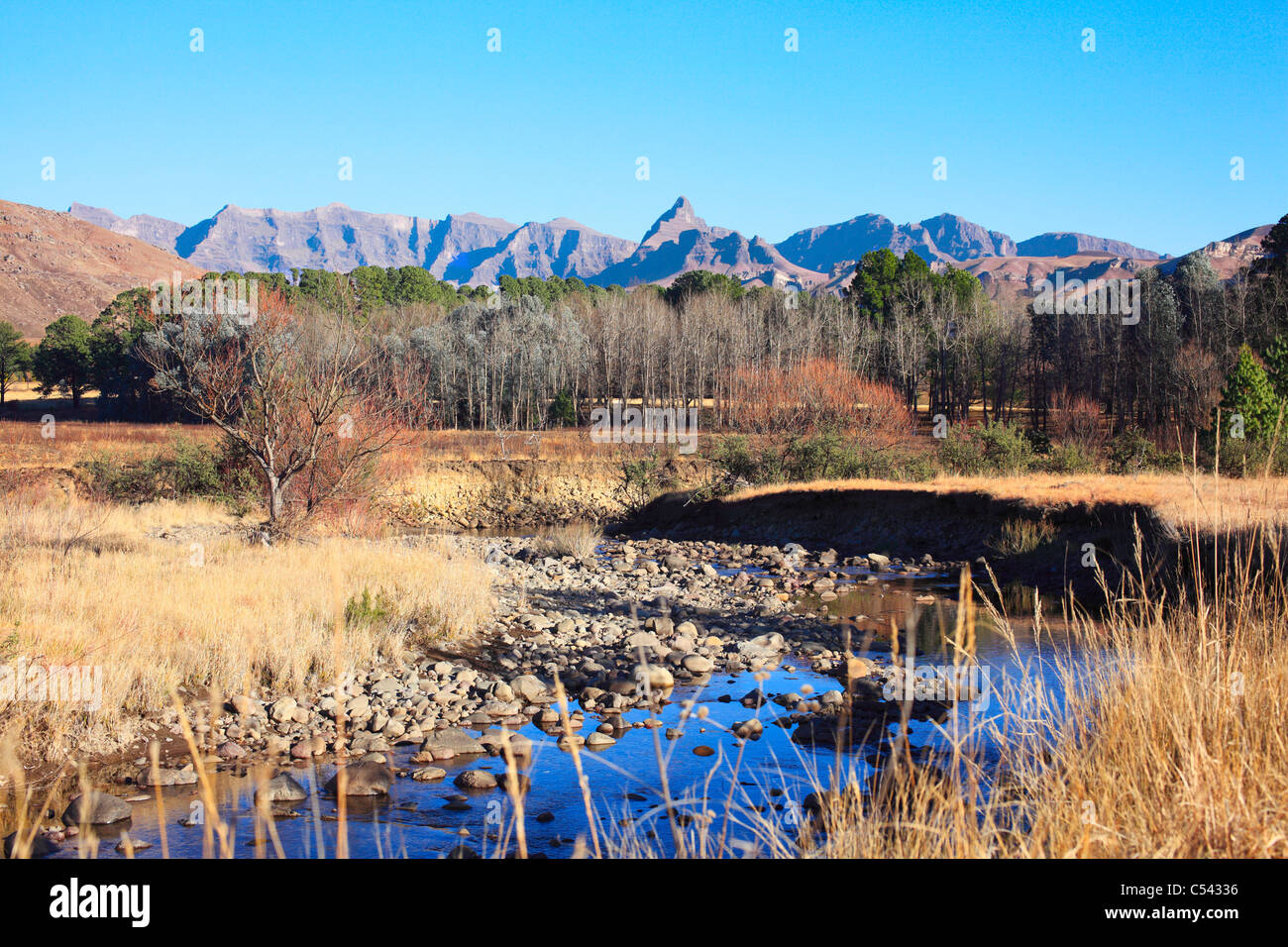 Winters view of a stream meandering through the foothills of the Southern Drakensberg. South Africa. Stock Photo