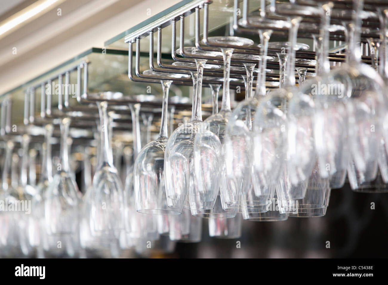 Wine glasses arranged in wine glass stand in a bar Stock Photo Alamy