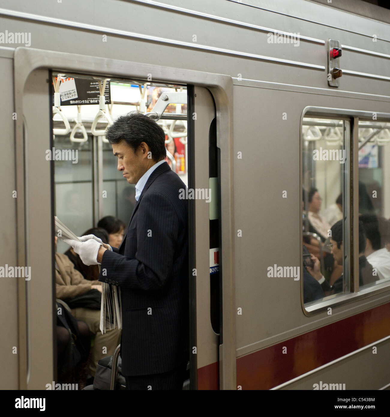 Passengers traveling in a subway train, Tokyo, Japan Stock Photo