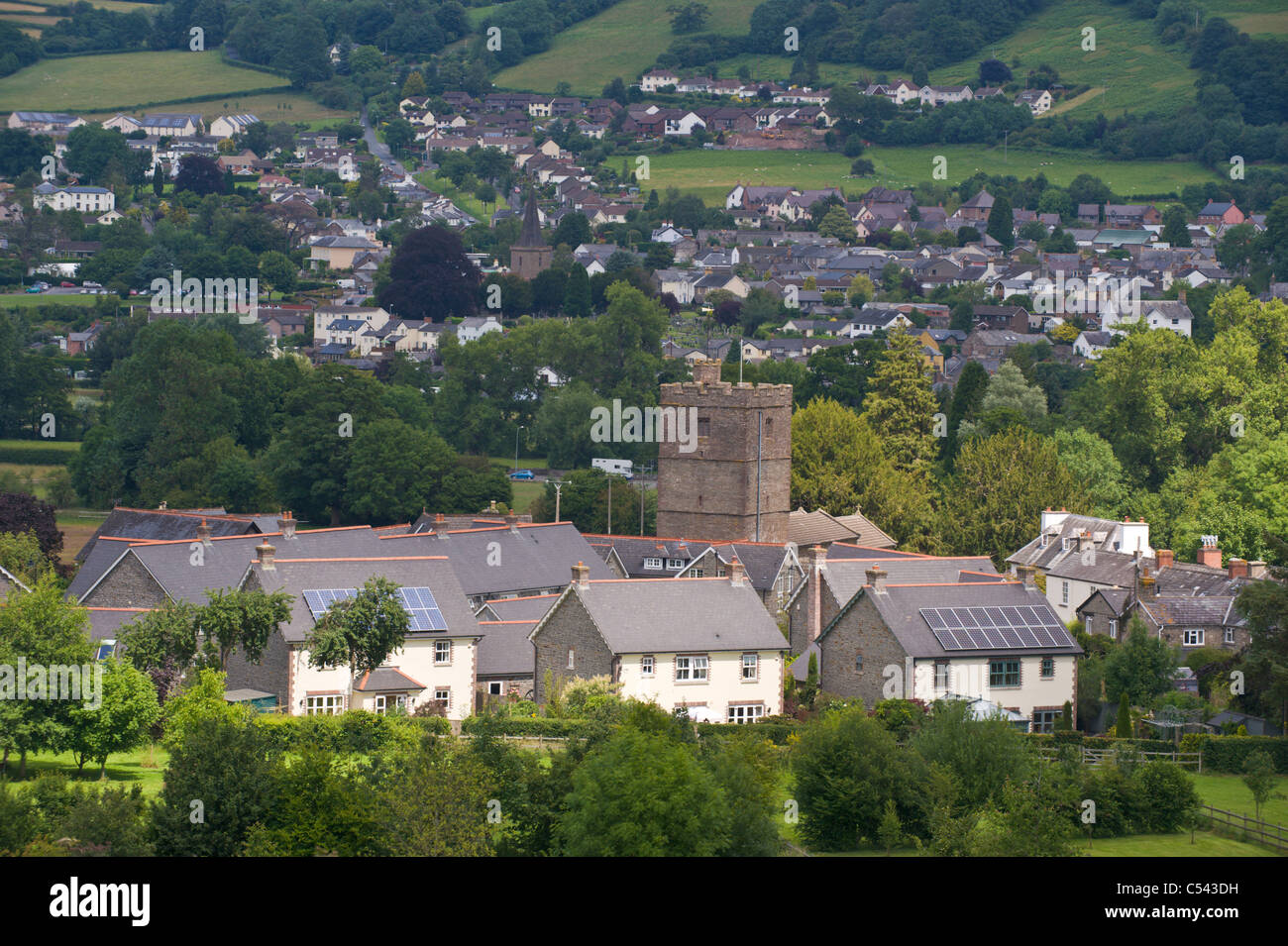 Solar panels on roof of detached houses in village of Llangattock Powys
