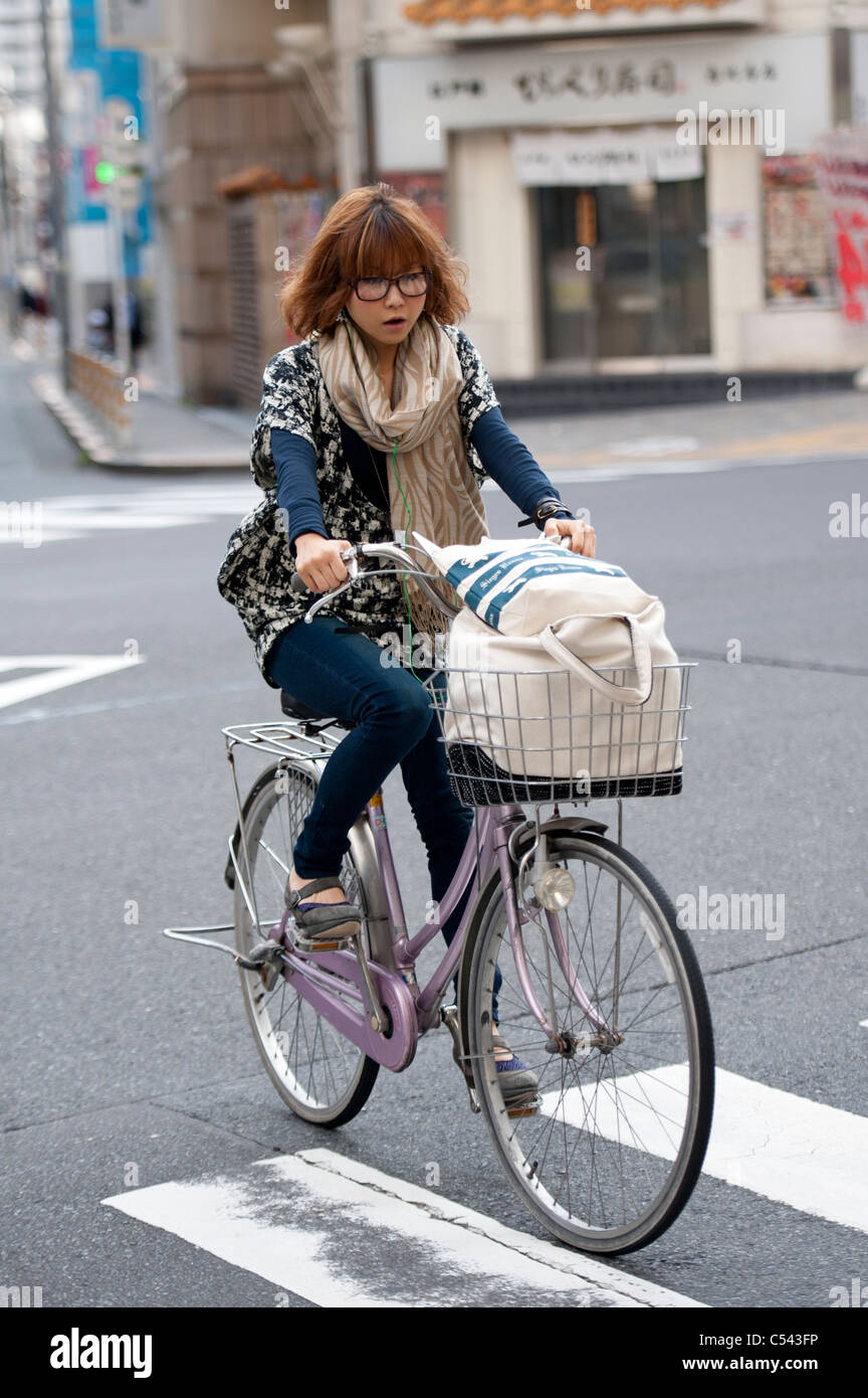 Woman riding a bicycle, Tokyo, Japan Stock Photo Alamy