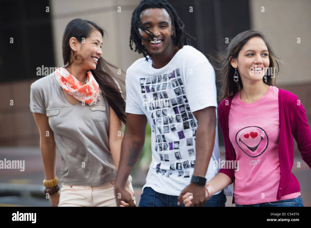 Man with his friends crossing road Stock Photo Alamy
