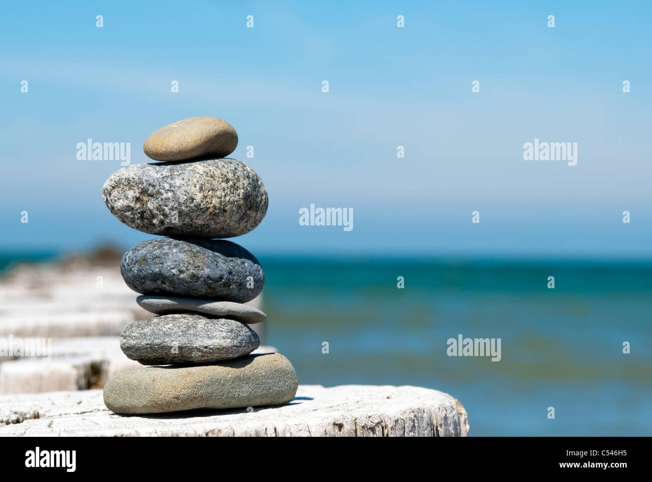 a tower of stones by the sea Stock Photo - Alamy