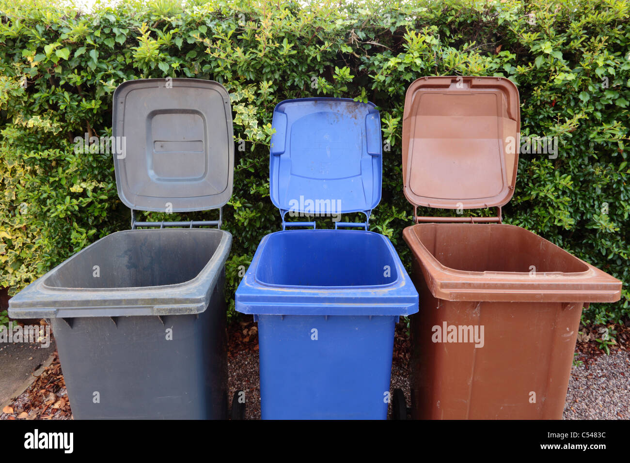 Three wheely bins open and empty. For the disposal of general household