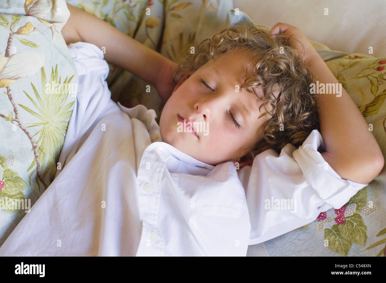 Little boy sleeping on couch Stock Photo Alamy