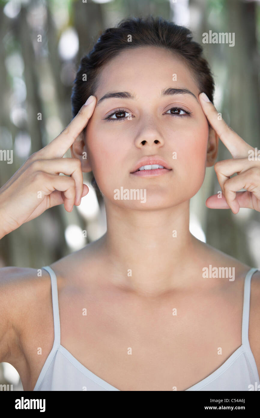 Meditating hands on temples hi-res stock photography and images - Alamy