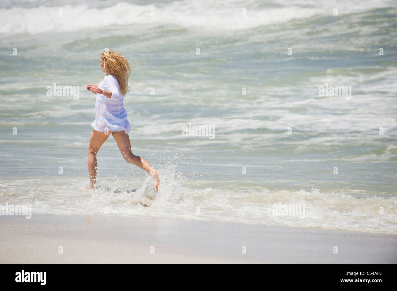 Beach Rode Side Profile Side profile of a woman running on the beach Stock Photo - Alamy