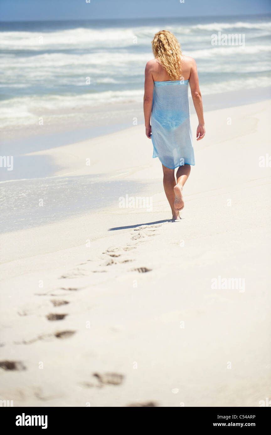 Rear view of a woman on the beach hi-res stock photography and images ...