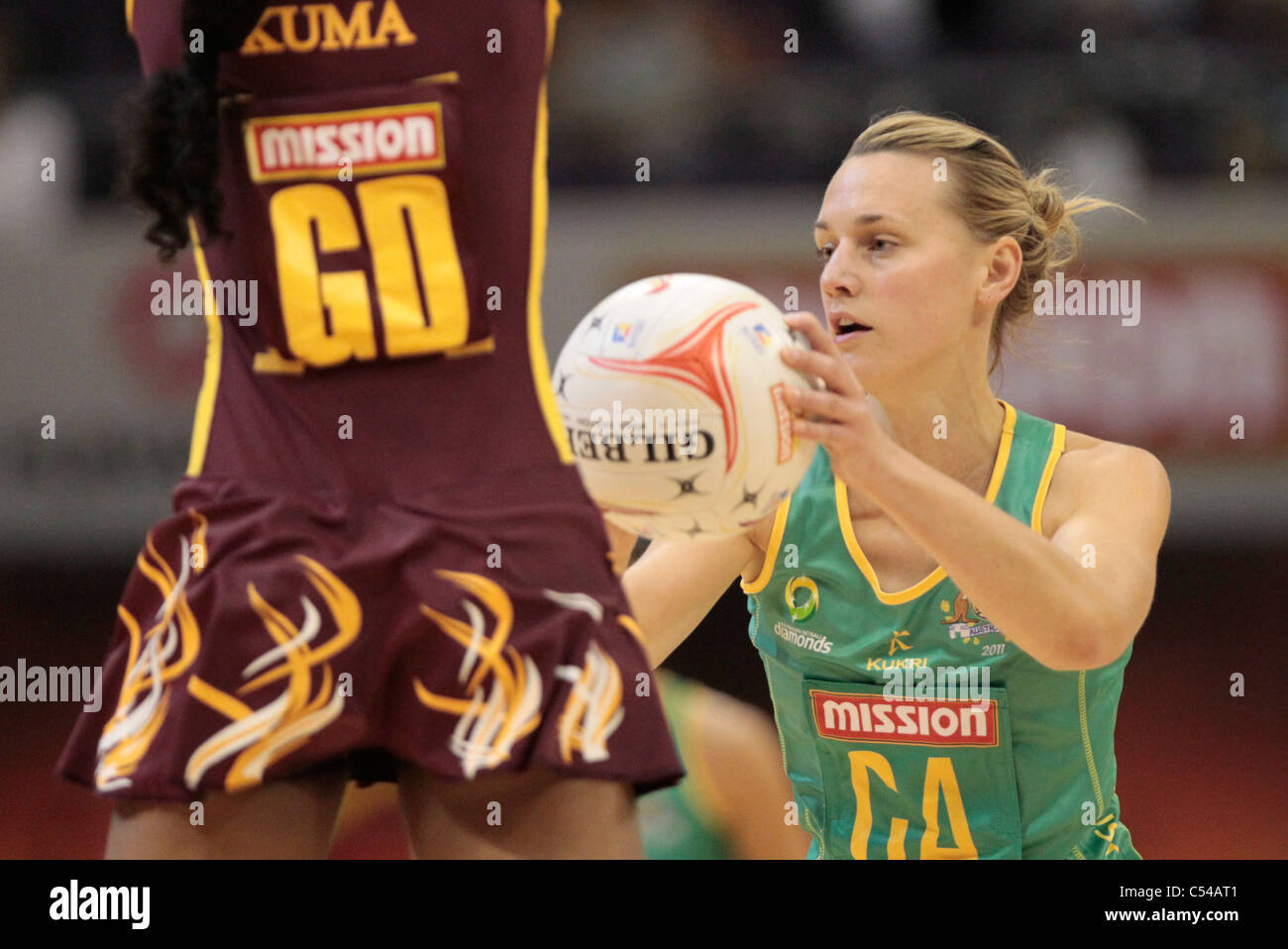 06.07.2011 Natalie Medhurst of Australia(right) in action during the Pool A match between Australia VS Sri Lanka, Mission Foods World Netball Championships 2011 from the Singapore Indoor Stadium in Singapore. Stock Photo