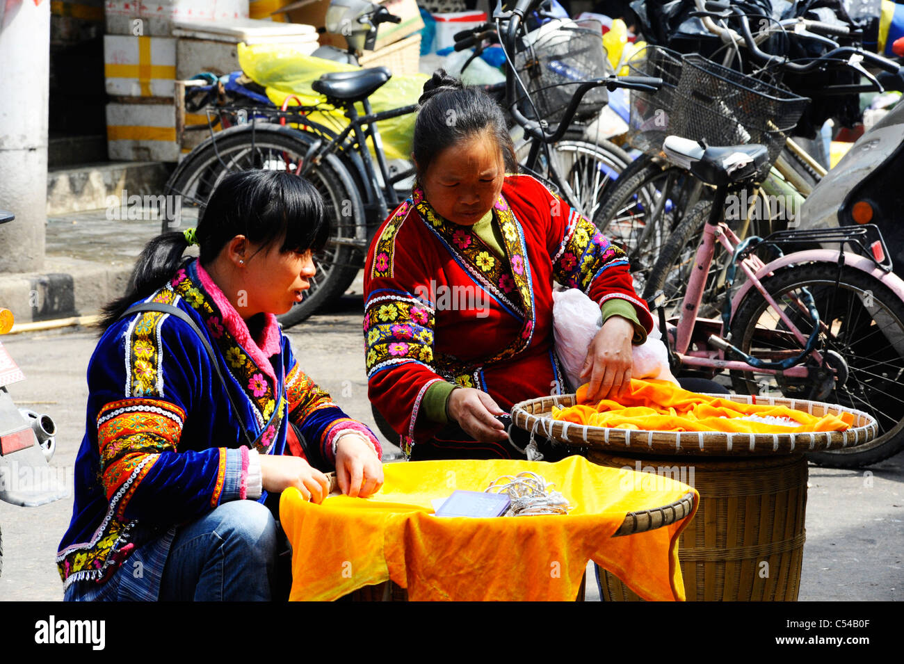 Chinese women making and selling craft goods in Shanghai old town Stock Photo