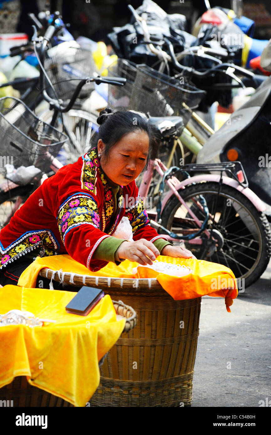 Chinese woman making and selling craft goods in Shanghai old town Stock Photo