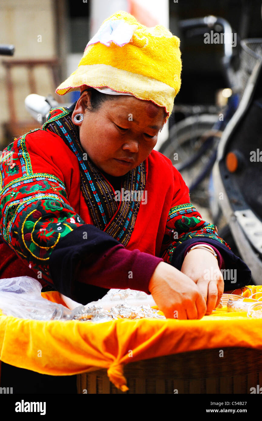 Chinese woman making and selling craft goods in Shanghai old town Stock Photo