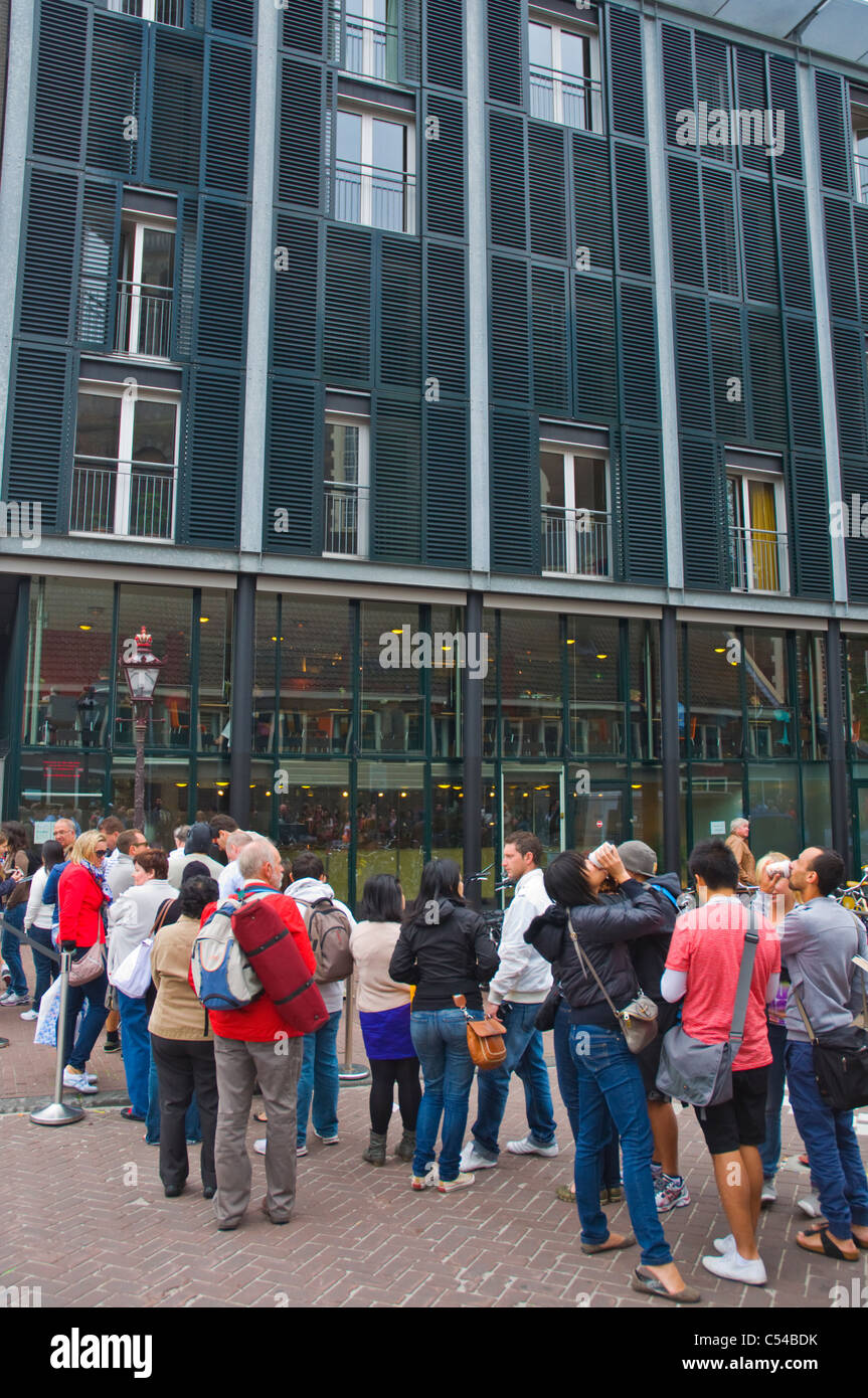Queue outside Het Anne Frank Huis the Anne Frank House musem central Amsterdam the Netherlands Europe Stock Photo