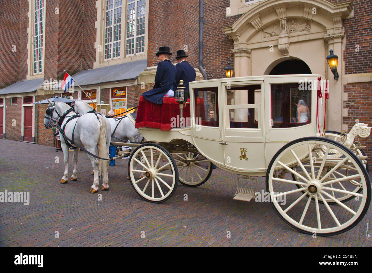 Horse carriage in front of Westerkerk church along Prinsengracht museum Amsterdam the Netherlands Europe Stock Photo