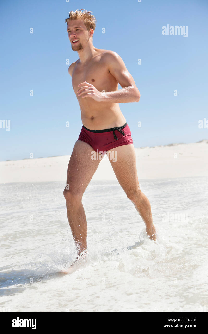 Man running on the beach Stock Photo Alamy