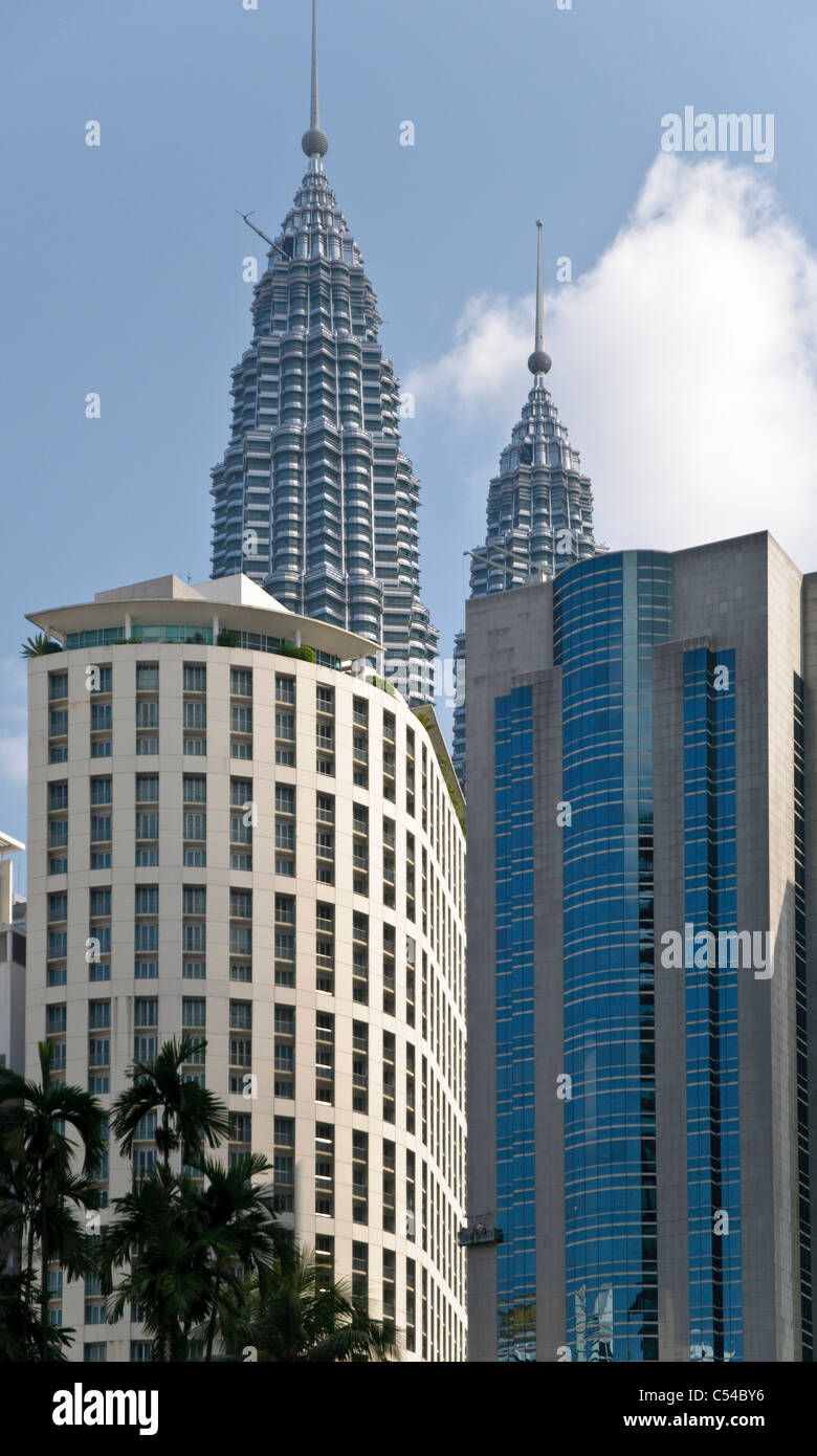 Petronas Twin Towers behind office buildings, Kuala Lumpur, Malaysia, Southeast Asia, Asia Stock Photo