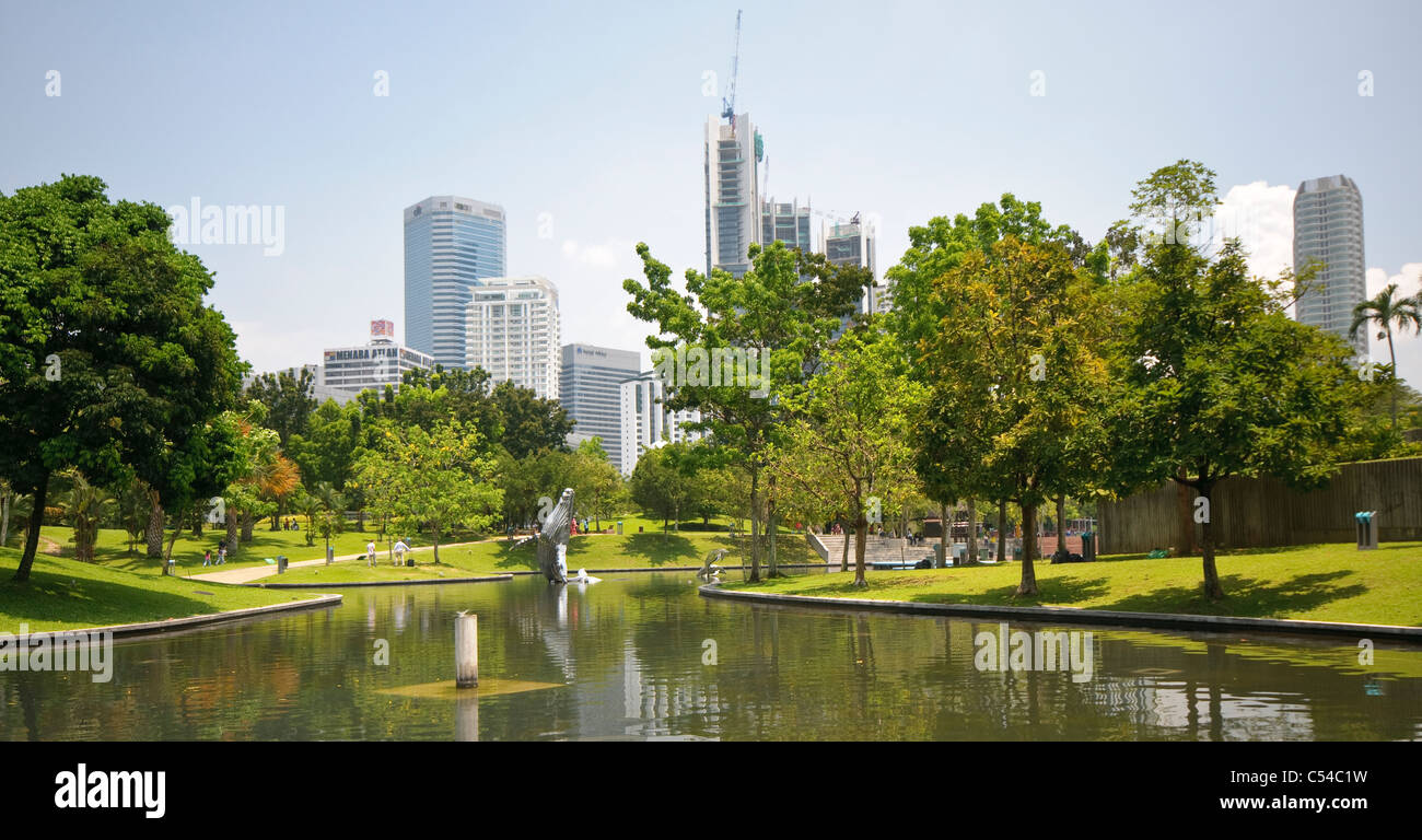 KLCC Park at the Petronas Twin Towers in front of the skyline with office buildings and hotels, Kuala Lumpur, Malaysia, Southeas Stock Photo