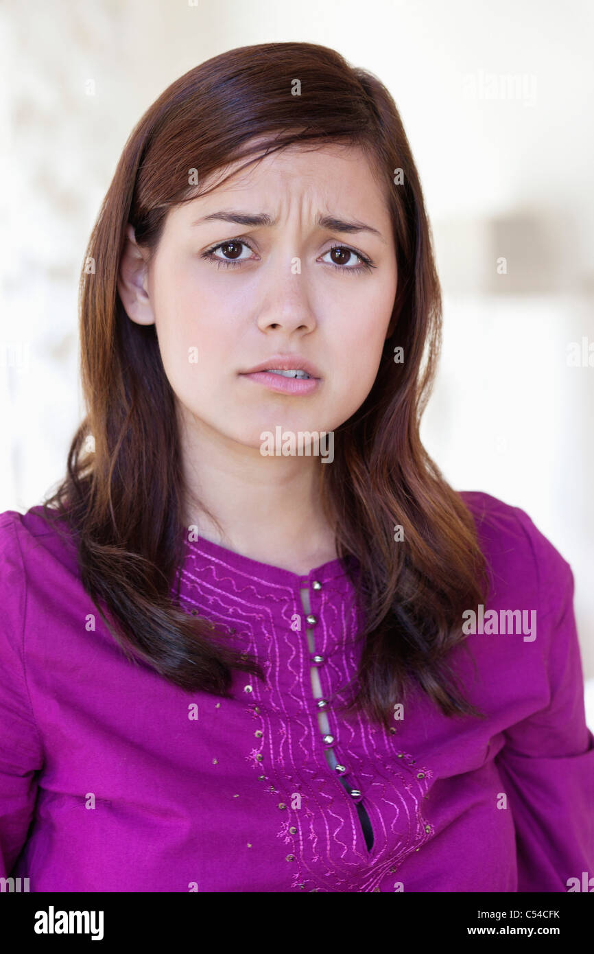 Portrait of a young woman looking sad Stock Photo