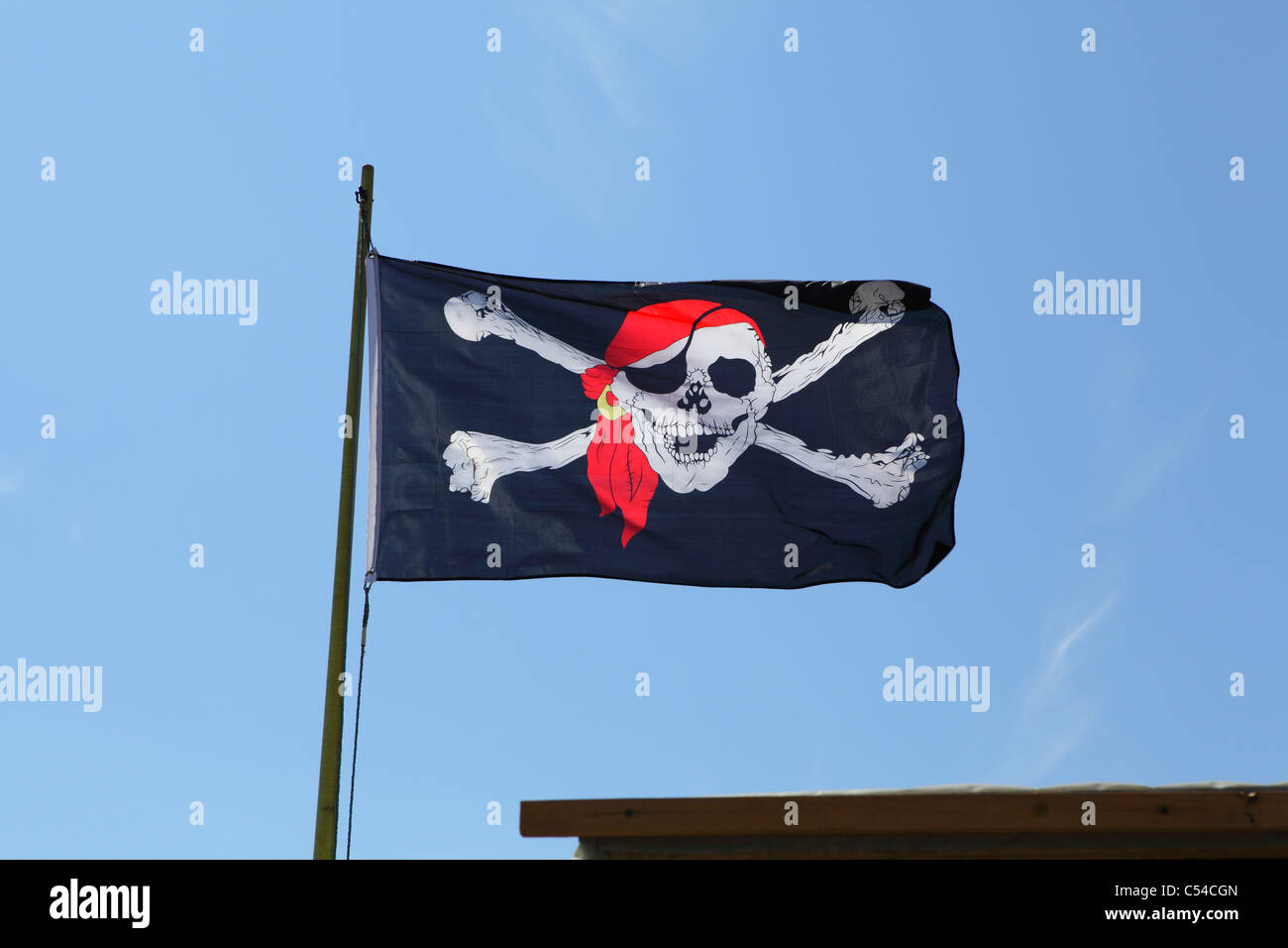 Skull and crossbones flag flying above fish market stalls in Hastings England UK Stock Photo Alamy