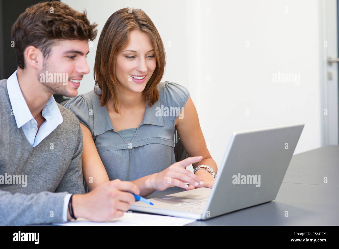 University students using laptop in classroom Stock Photo Alamy