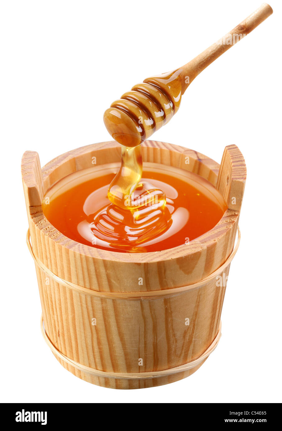 Piggin of honey and wooden stick. Stock Photo