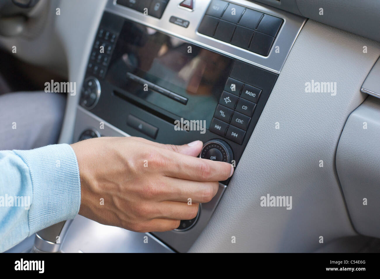 Man increasing the music volume Stock Photo