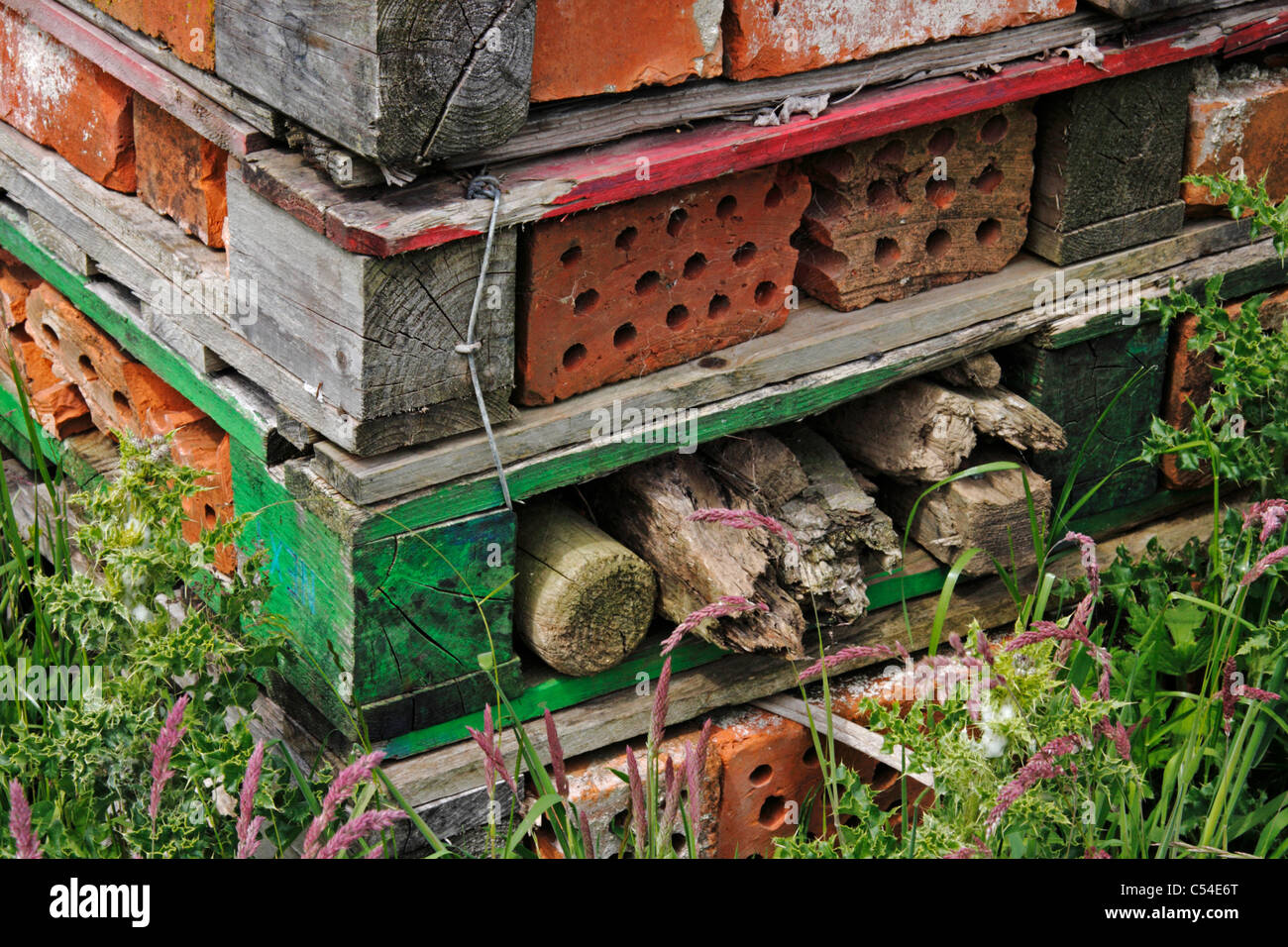 Bug Hotel or wildlife shelter to provide dry and warm conditions for nesting and hibernating insects, invertebrates, frogs, etc. Stock Photo