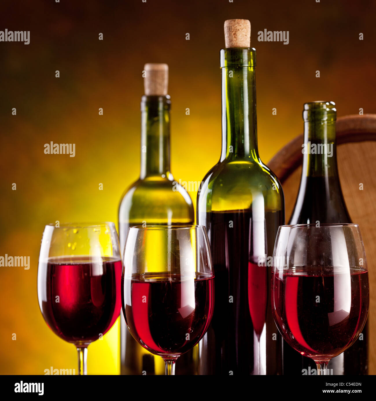 Still life with wine bottles, glasses and oak barrels Stock Photo - Alamy