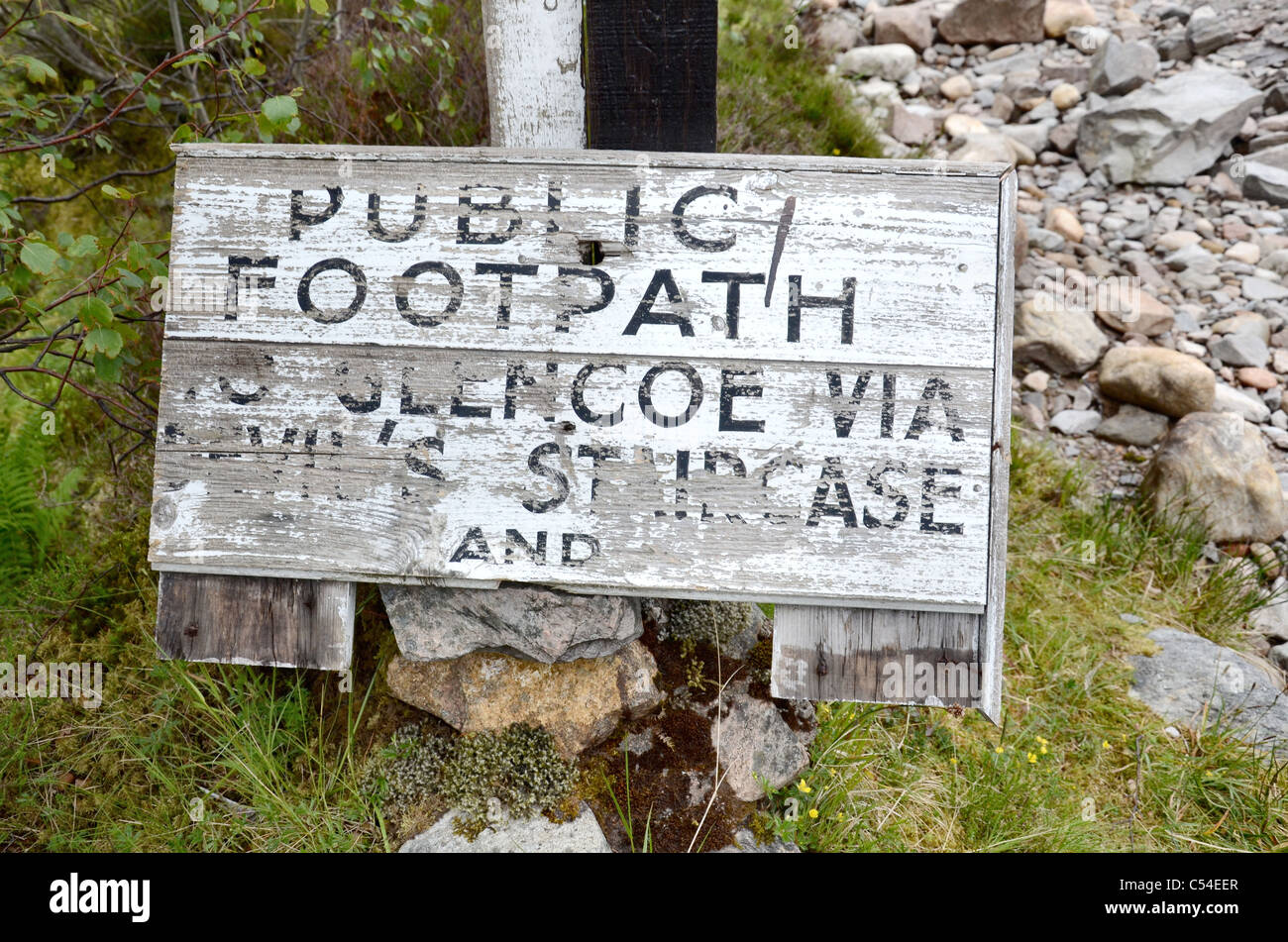 A rather weathered sign on part of the West Highland Way marking the path to Glencoe and the Devil's Staircase. Stock Photo