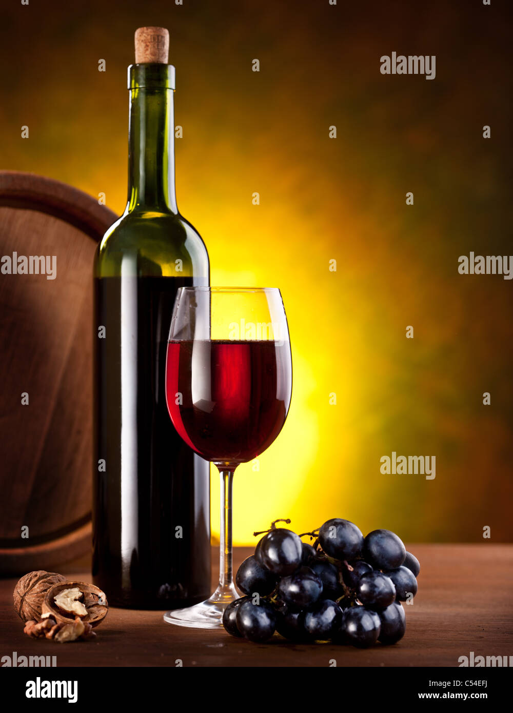 Still life with wine bottle, glass and oak barrels Stock Photo - Alamy