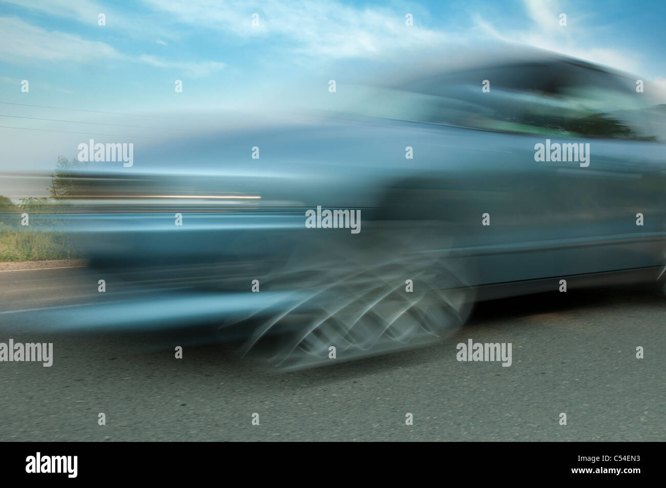 High speed blurred car with blue sky Stock Photo - Alamy