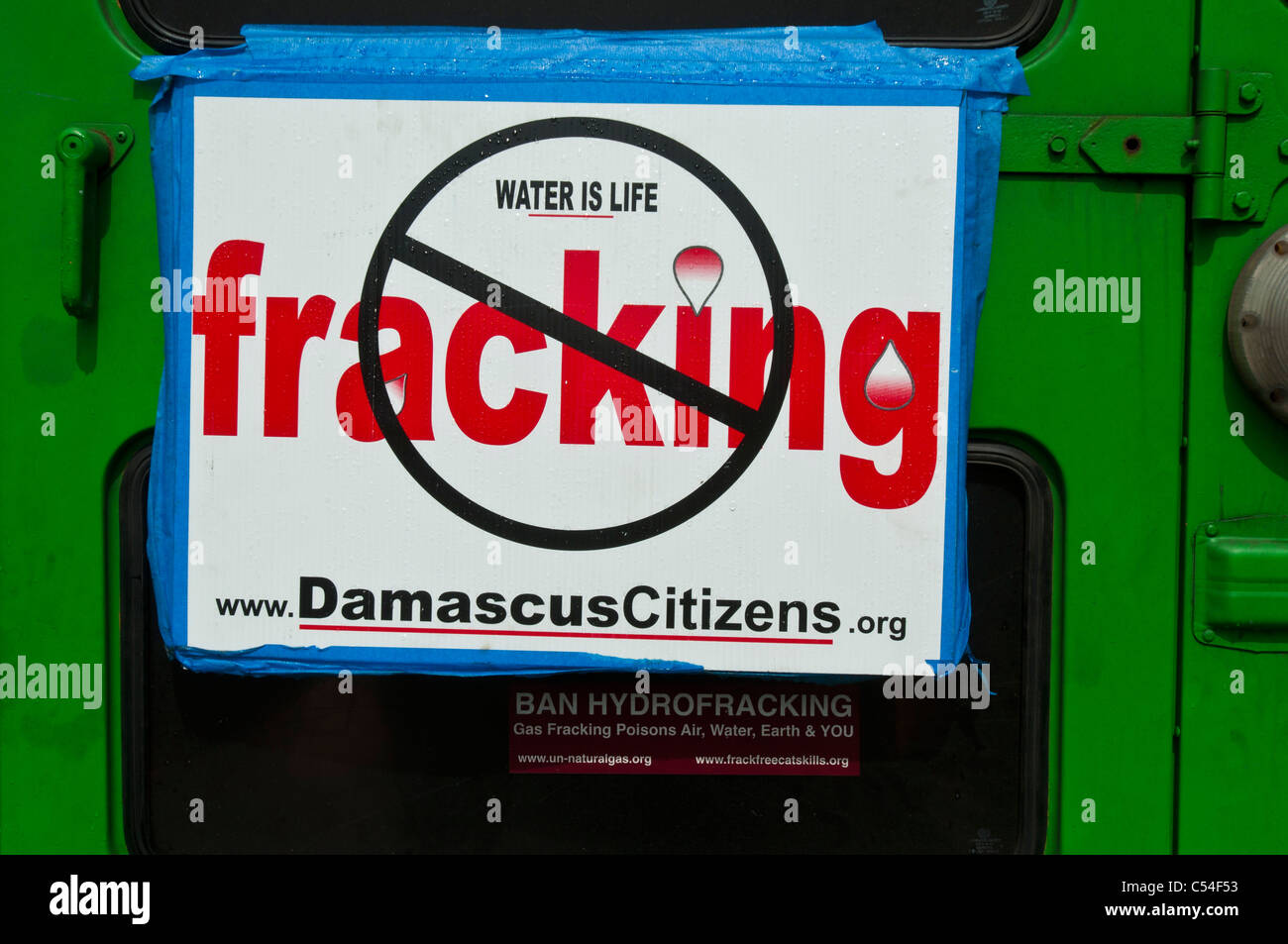 Water is life, anti fracking plate on green car, New York, USA Stock Photo