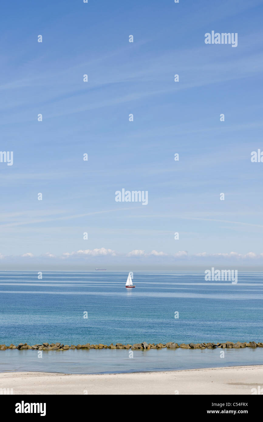 Sailing boat off Ahrenshoop steep coast, Fischland-Darss-Zingst peninsula, Baltic Sea, Germany Stock Photo