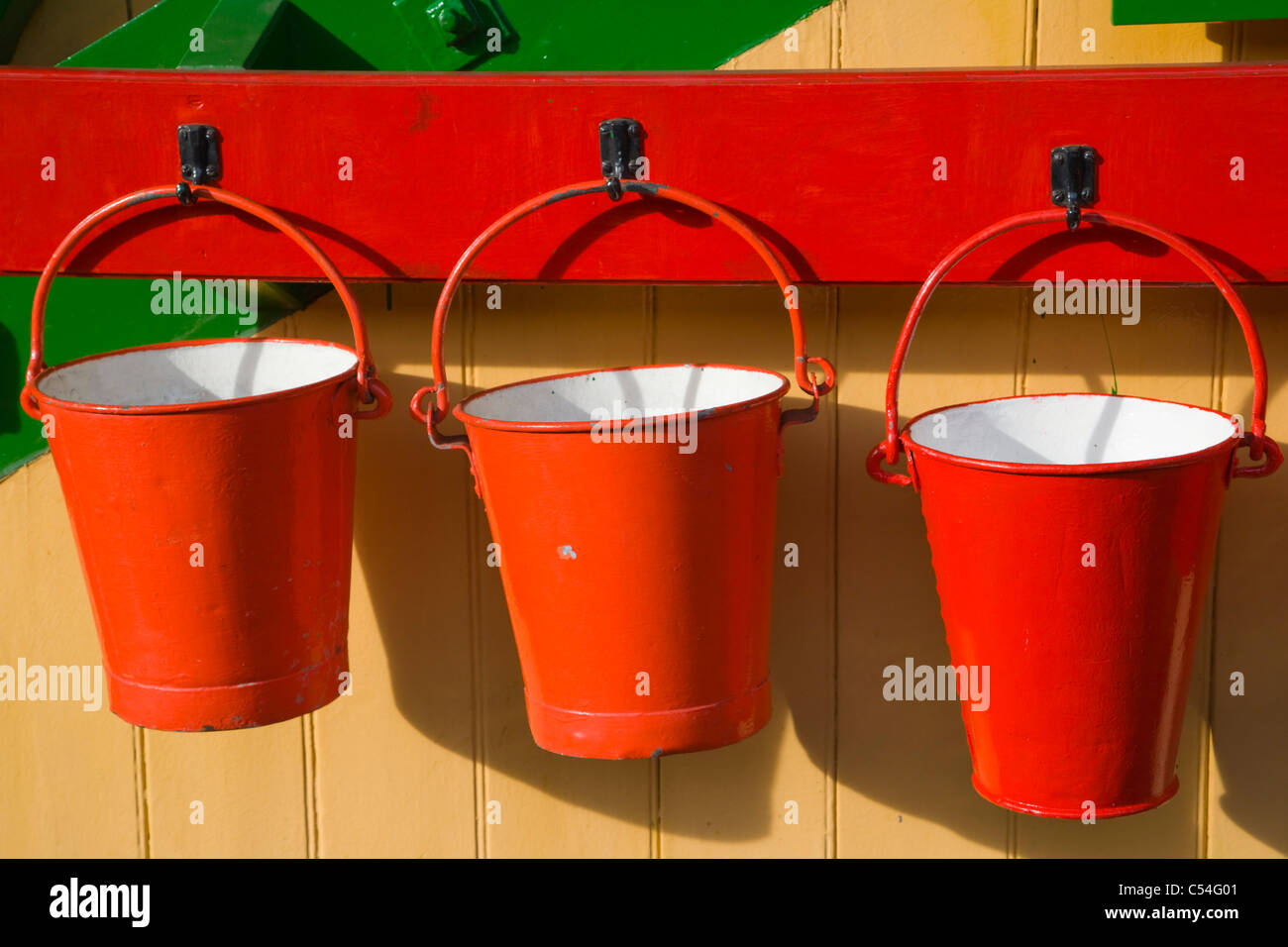 Three red fire buckets, Alton Station, Mid Hants Railway Station, Watercress Line, Hampshire, England, UK Stock Photo