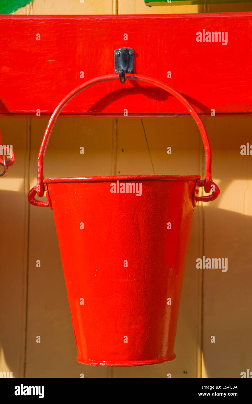 One red fire bucket, Alton Station, Mid Hants Railway Station, Watercress Line, Hampshire, England, UK Stock Photo