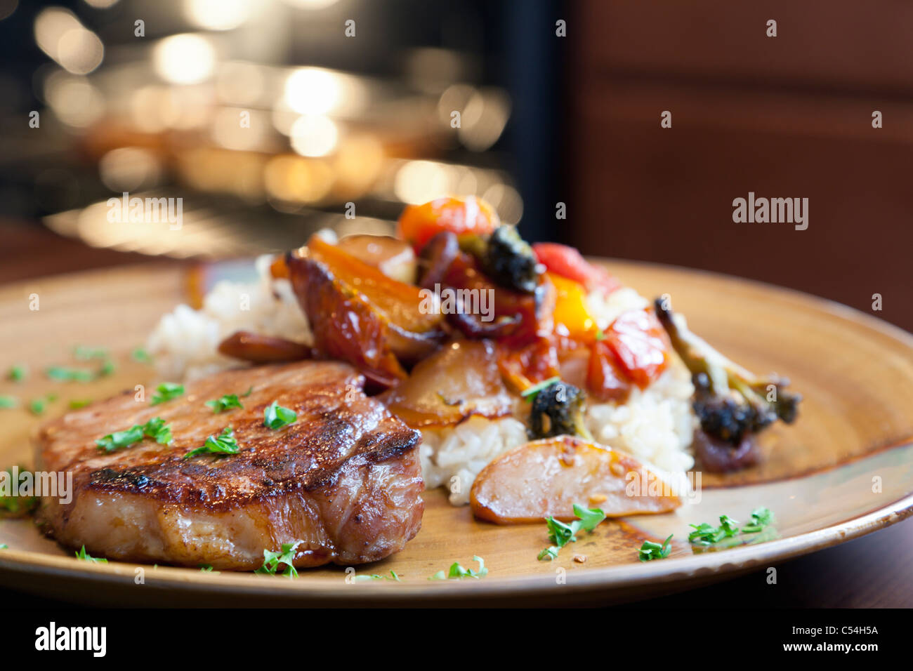 Pork, rice, and roasted vegetables Stock Photo