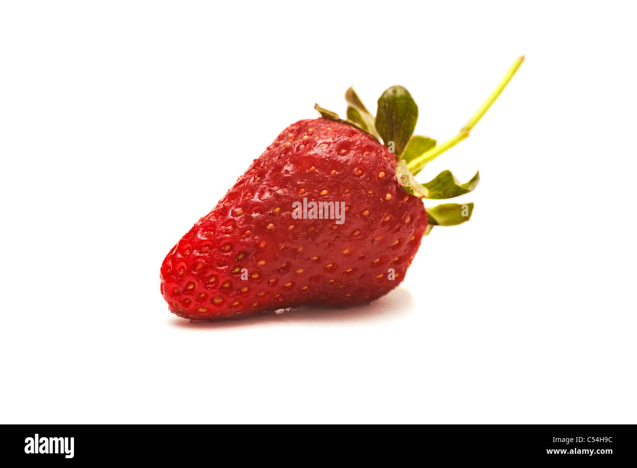 A fresh strawberry isolated on white background closeup Stock Photo - Alamy