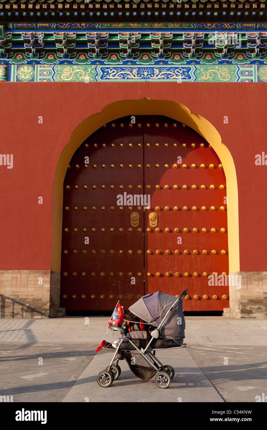 Baby carriage in front of a gate at the Temple Of Heaven, Beijing, China Stock Photo