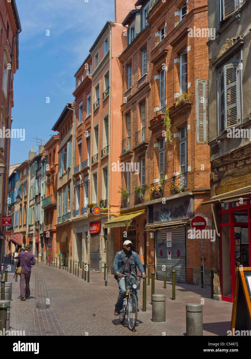 Toulouse, France, People Cycling in Pedestrian Street in Old Town Center Stock Photo