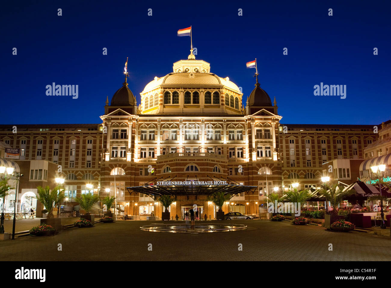 The Netherlands, Scheveningen near The Hague, hotel called Grand Hotel Amrâth Kurhaus. Dusk. Stock Photo