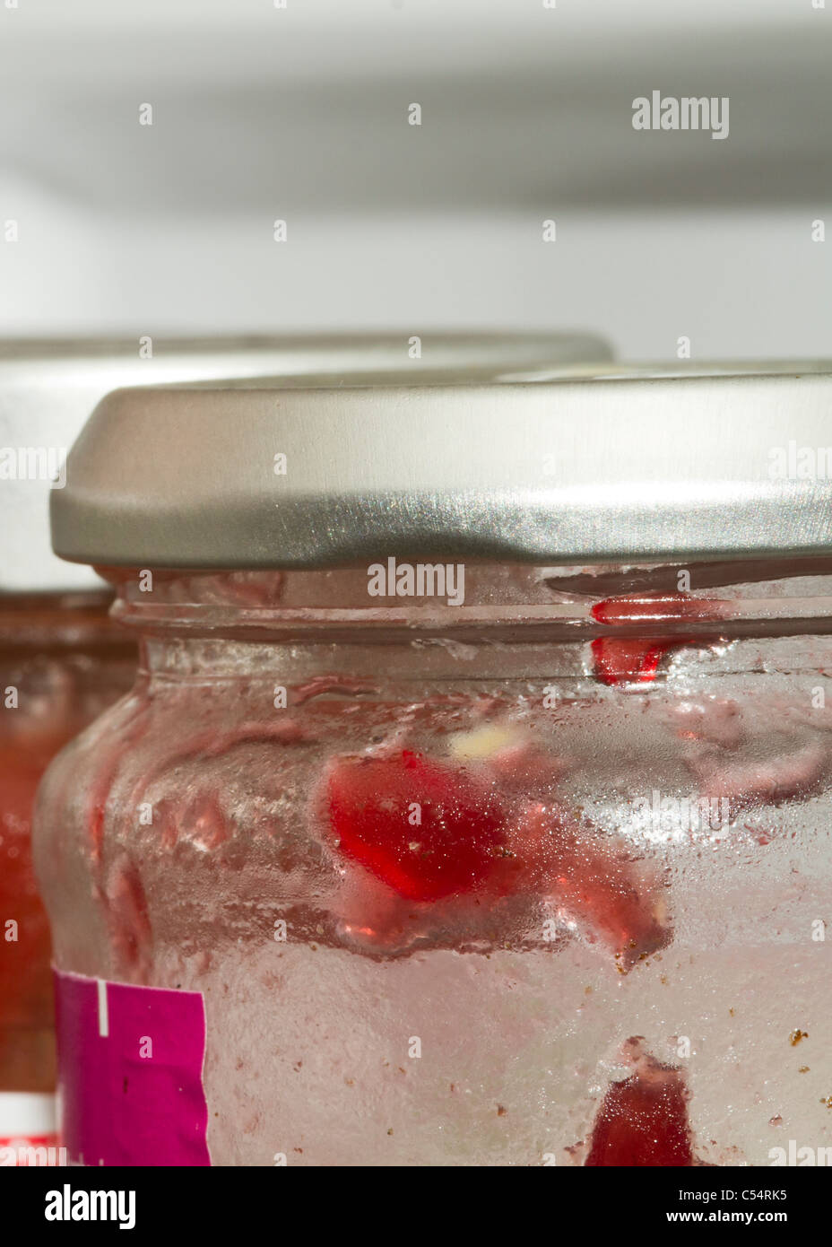 Used Jam Jar in the fridge closeup Stock Photo Alamy