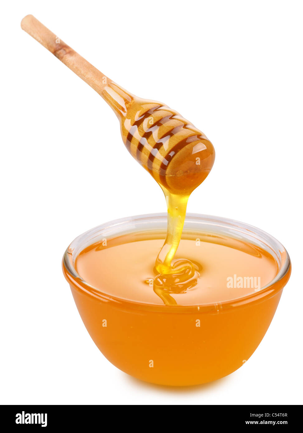 Bowl of honey and wooden stick isolated on a white. Stock Photo