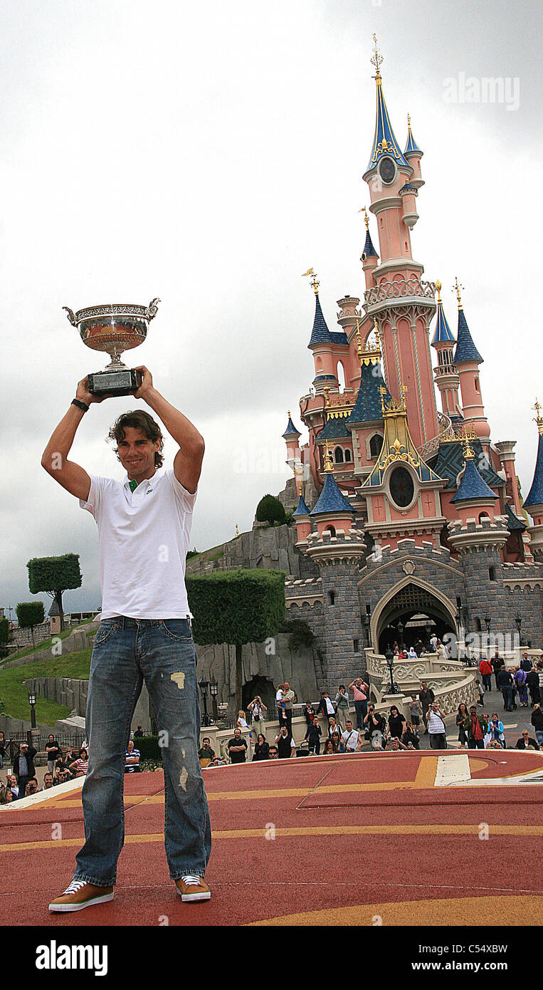 Rafael Nadal won a record-equalling sixth French Open title is pictured with his trophy at Disneyland in Paris. Stock Photo