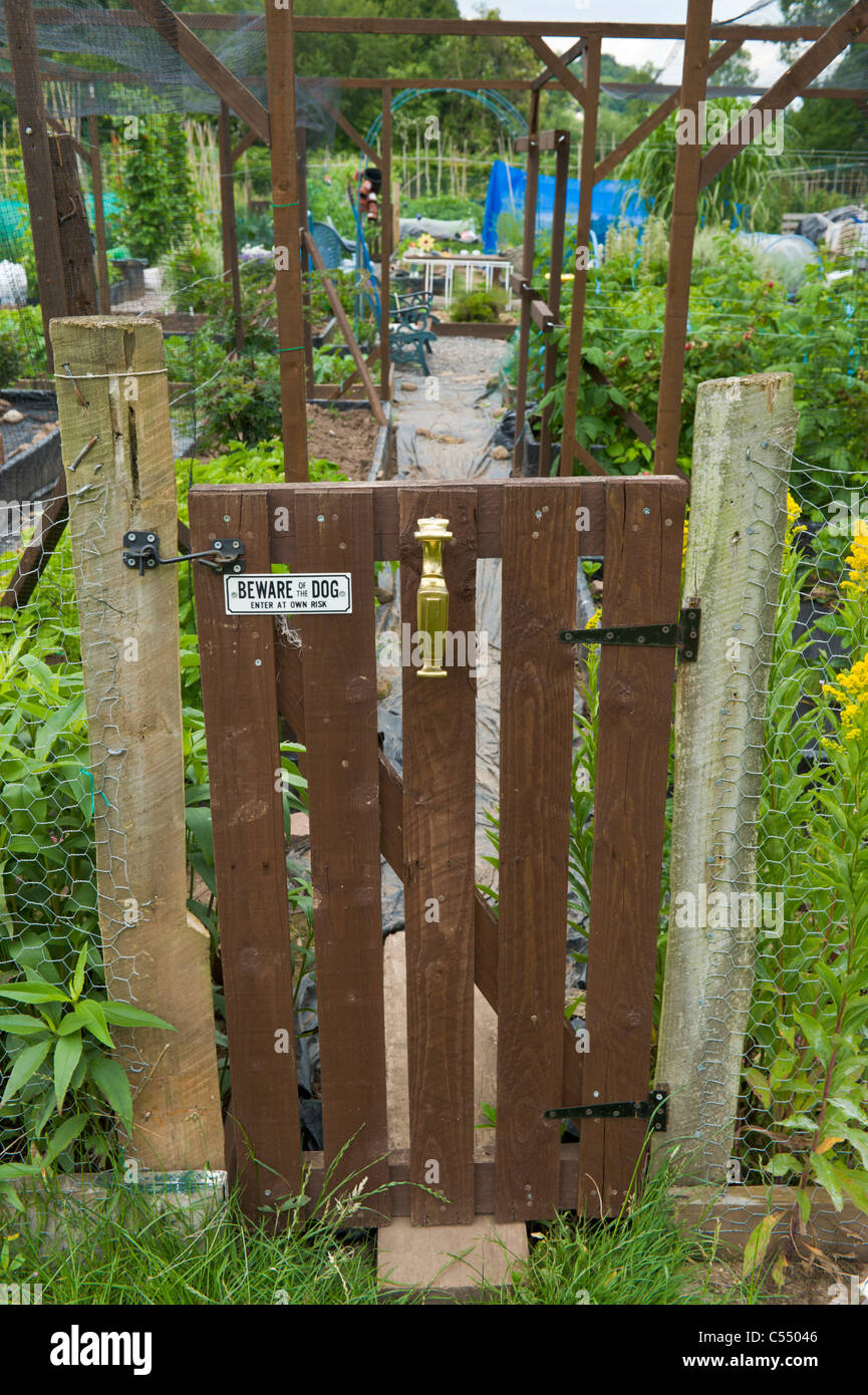 Garden gate entrance to community allotments in village of Llangattock Powys South Wales UK Stock Photo