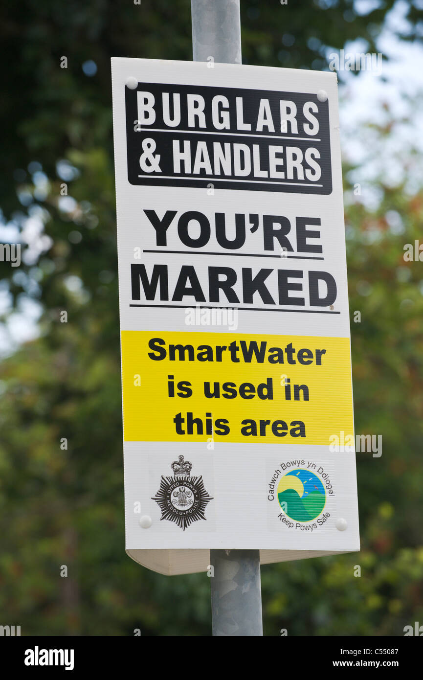SmartWater crime prevention sign in village of Llangattock Powys South Wales UK Stock Photo