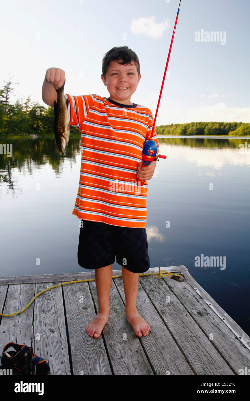 Boy bass fishing in a lake Stock Photo Alamy