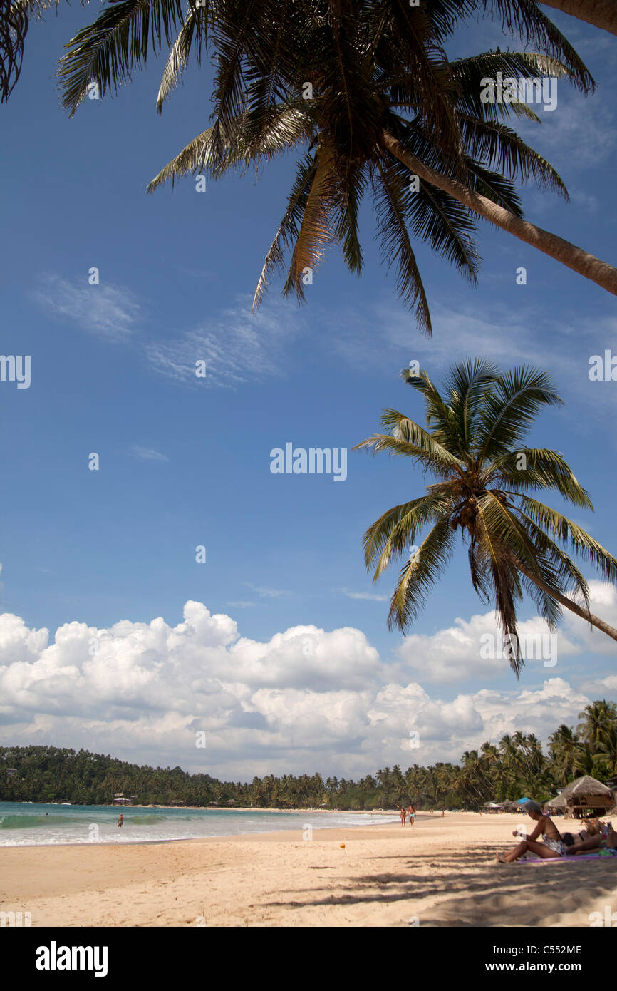 tourists at the dream beach in Mirissa, Sri Lanka Stock Photo