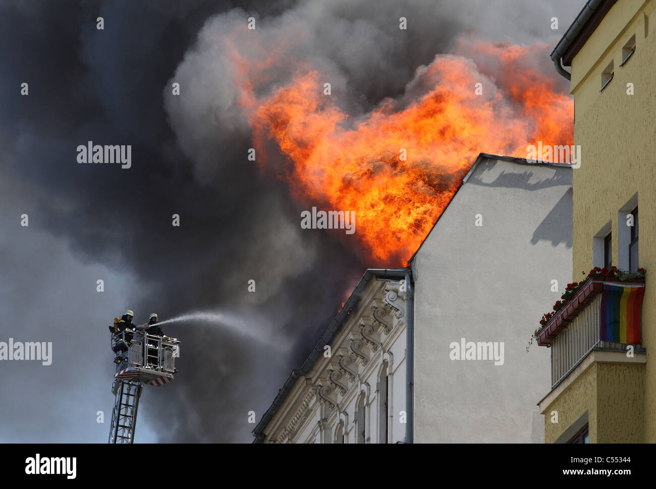 Firefighters putting out a fire in a burning house, Berlin, Germany Stock Photo